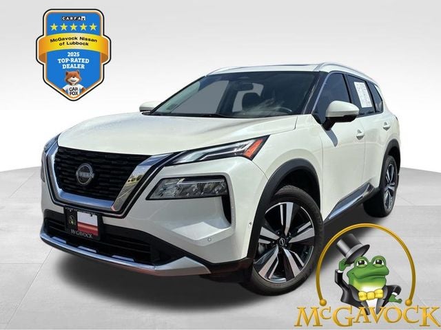 2023 Nissan Rogue Platinum in Pearl White Tricoat — front three-quarter view