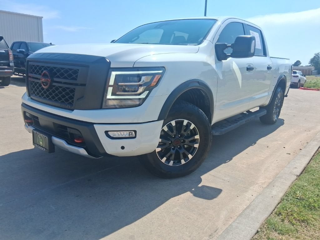 2024 Nissan Titan PRO-4X in Glacier White — front three-quarter view